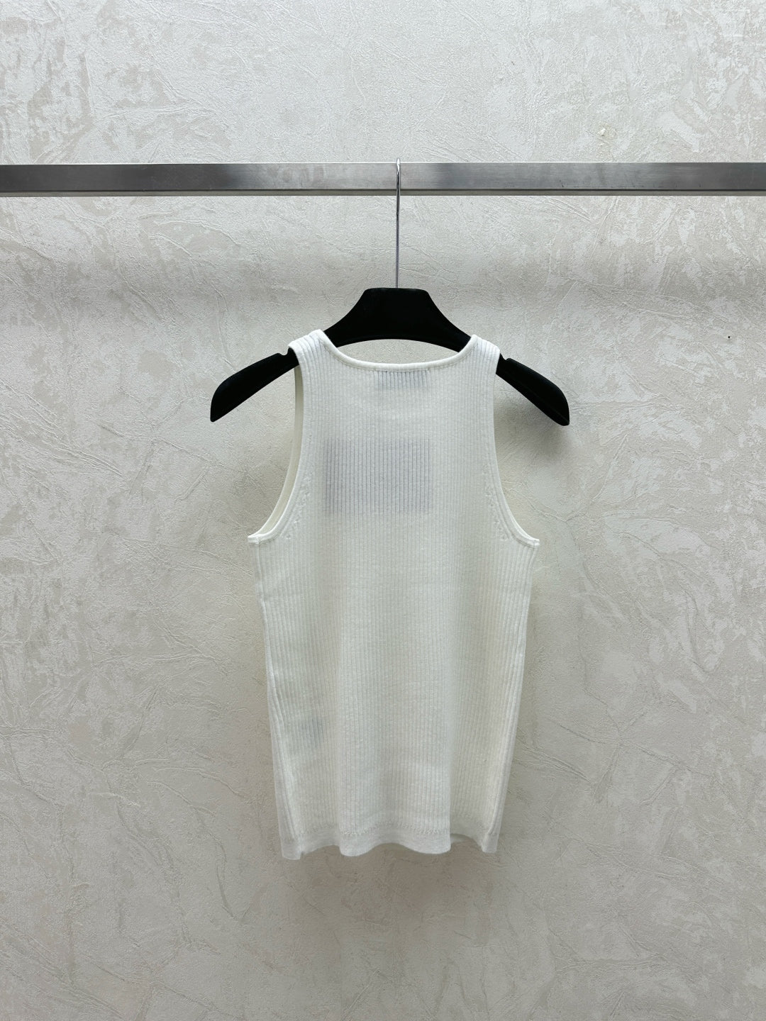 Delicately embroidered lettering straps on the chest