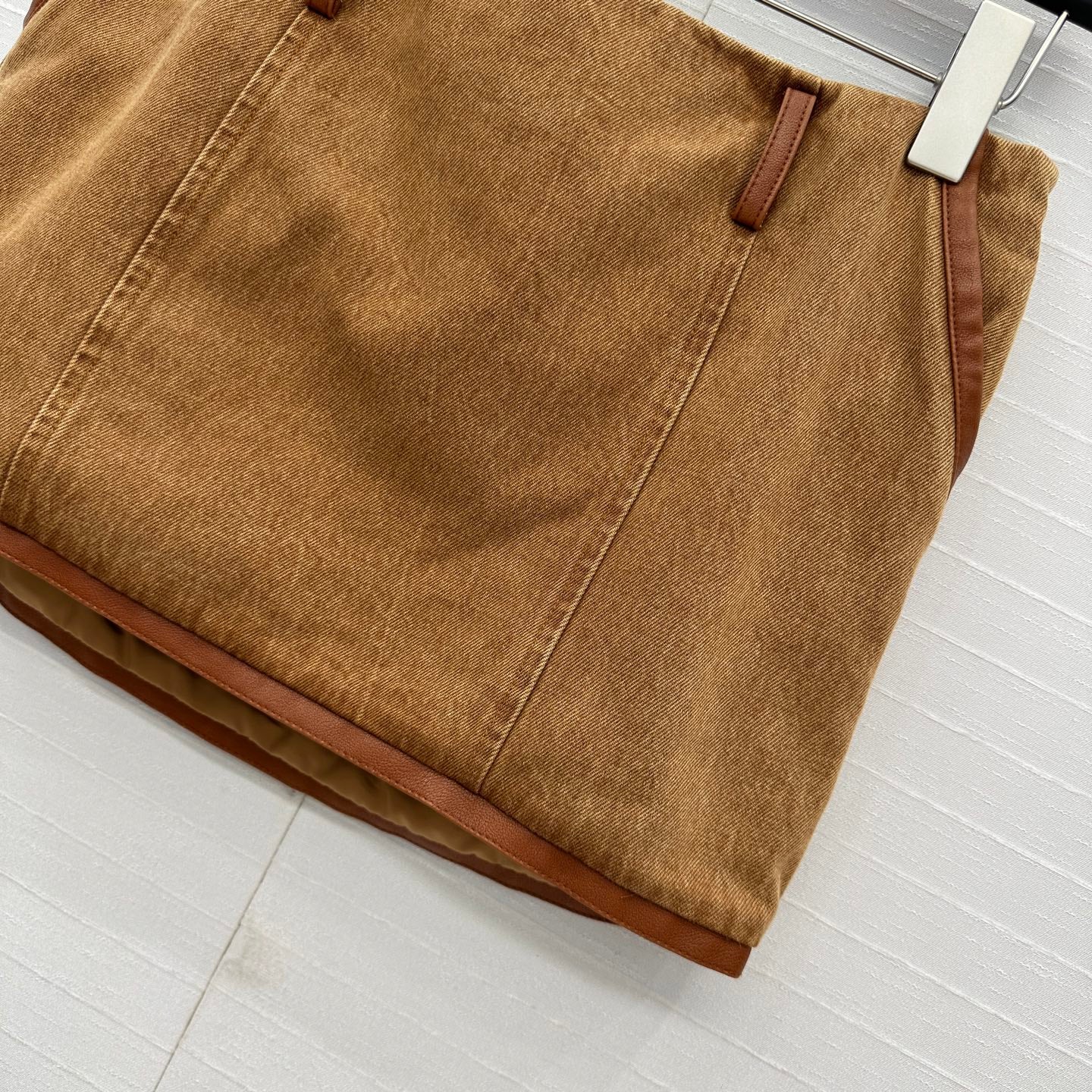 25 Egg white leather wrap around low waisted denim half skirt that