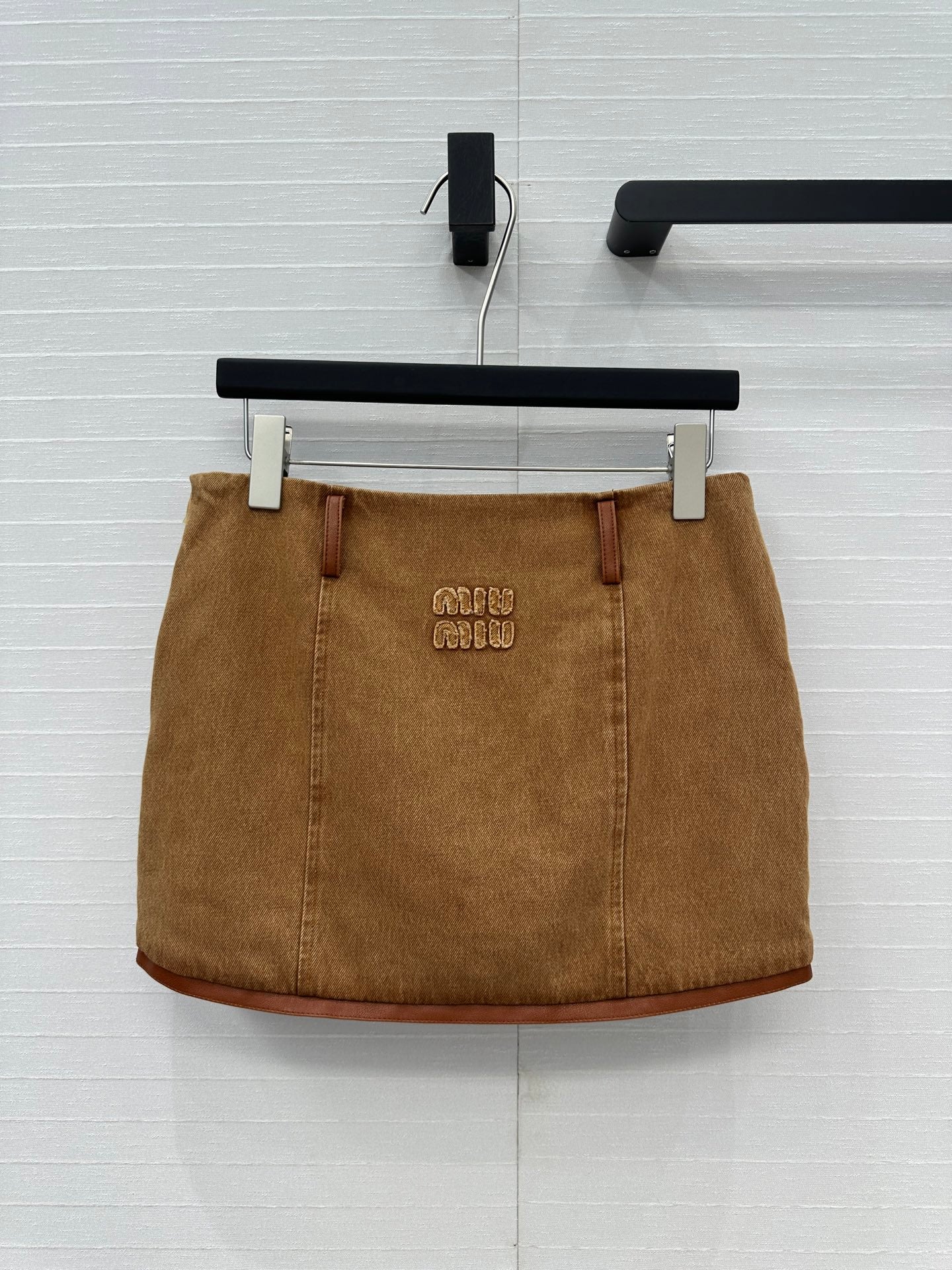25 Egg white leather wrap around low waisted denim half skirt that