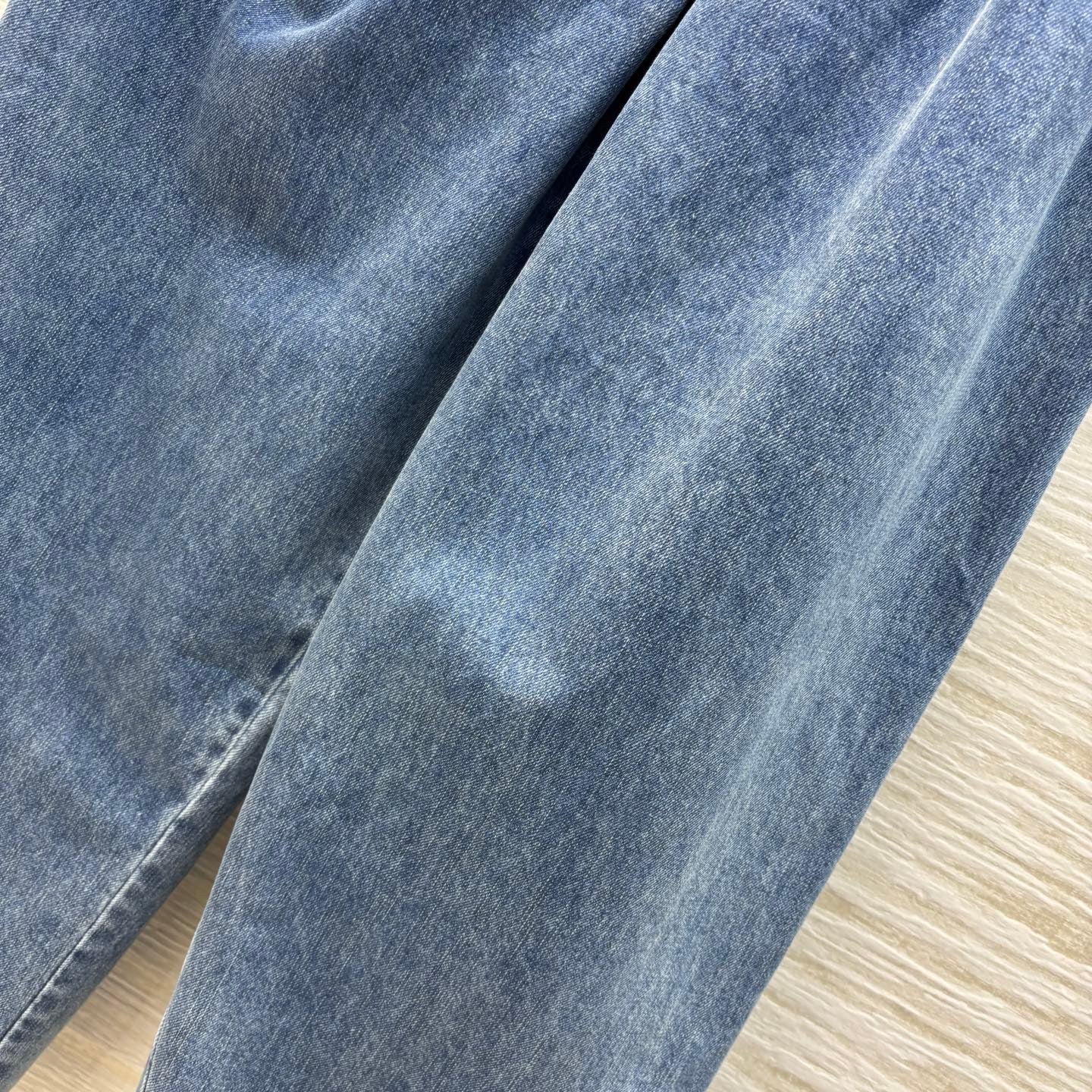 25ss wide-leg denim trousers with crinkled logo and leather trim