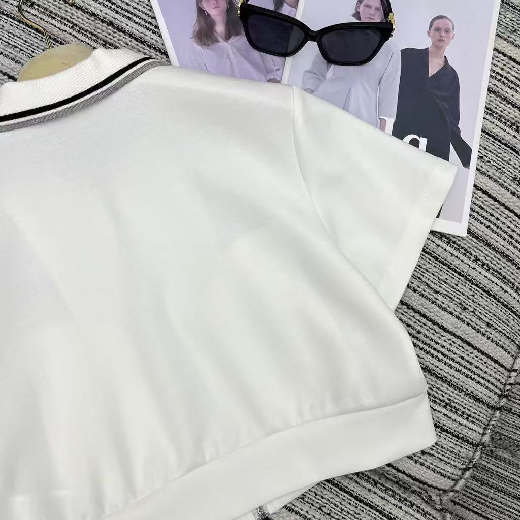 25ss New color blocked edge lapel short sleeved top paired with elastic waist short skirt set
