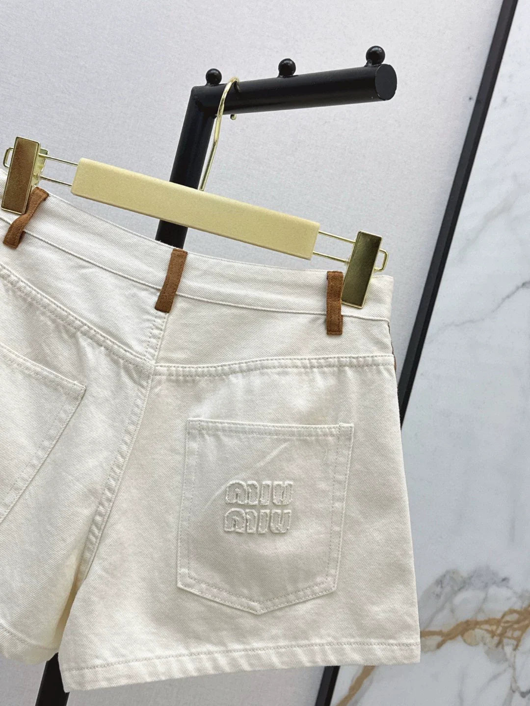 M 25 Spring/Summer Latest Patchwork Leather Embellished Denim Shorts