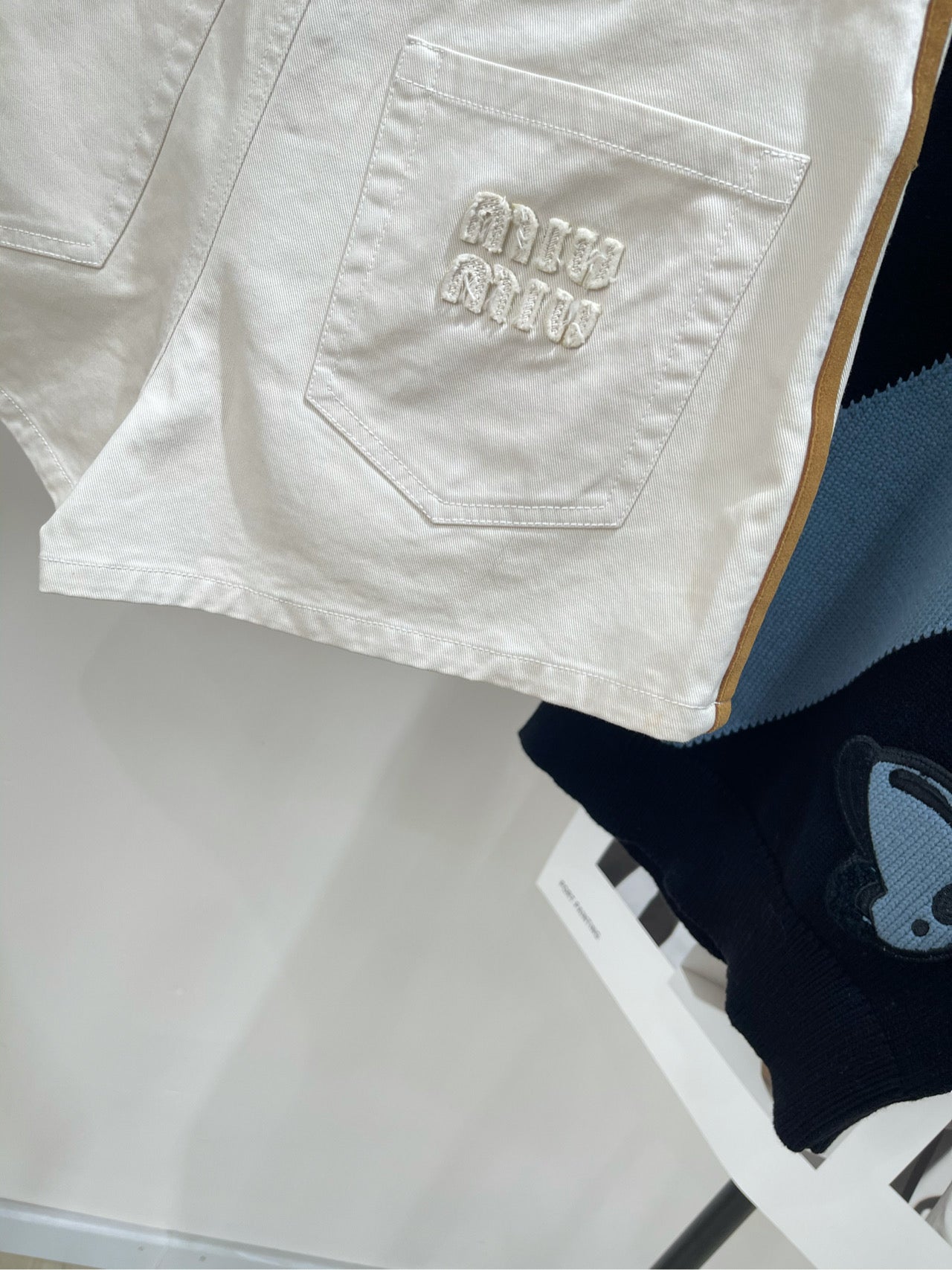 M 25 white suede velvet trim denim shorts