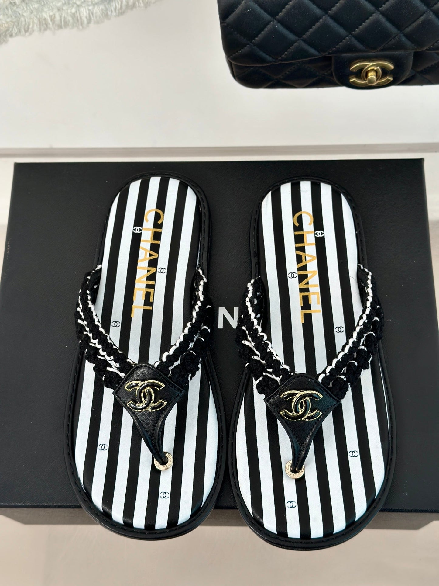 25 Thong Sandal Braided Striped Black White