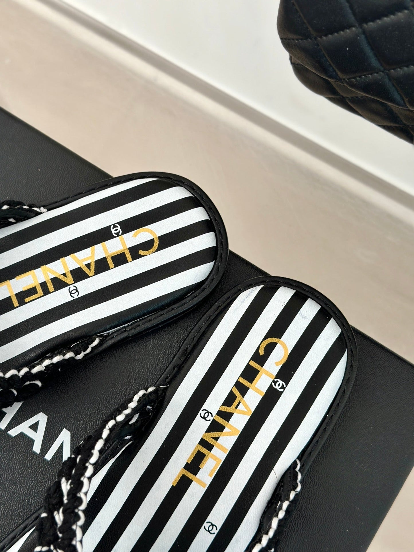25 Thong Sandal Braided Striped Black White