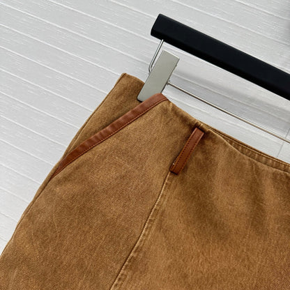 25 Egg white leather wrap around low waisted denim half skirt that