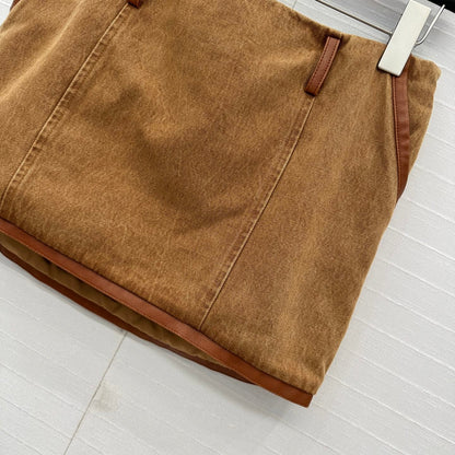 25 Egg white leather wrap around low waisted denim half skirt that