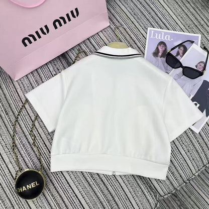 25ss New color blocked edge lapel short sleeved top paired with elastic waist short skirt set