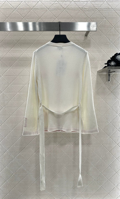 C New 25-item bag button and belted knitted cardigan.